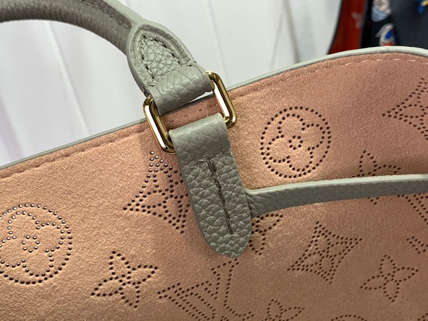 Louis Vuitton M23395 Bella Tote handbag combines a bucket bag  travel bag with perforated cow leather